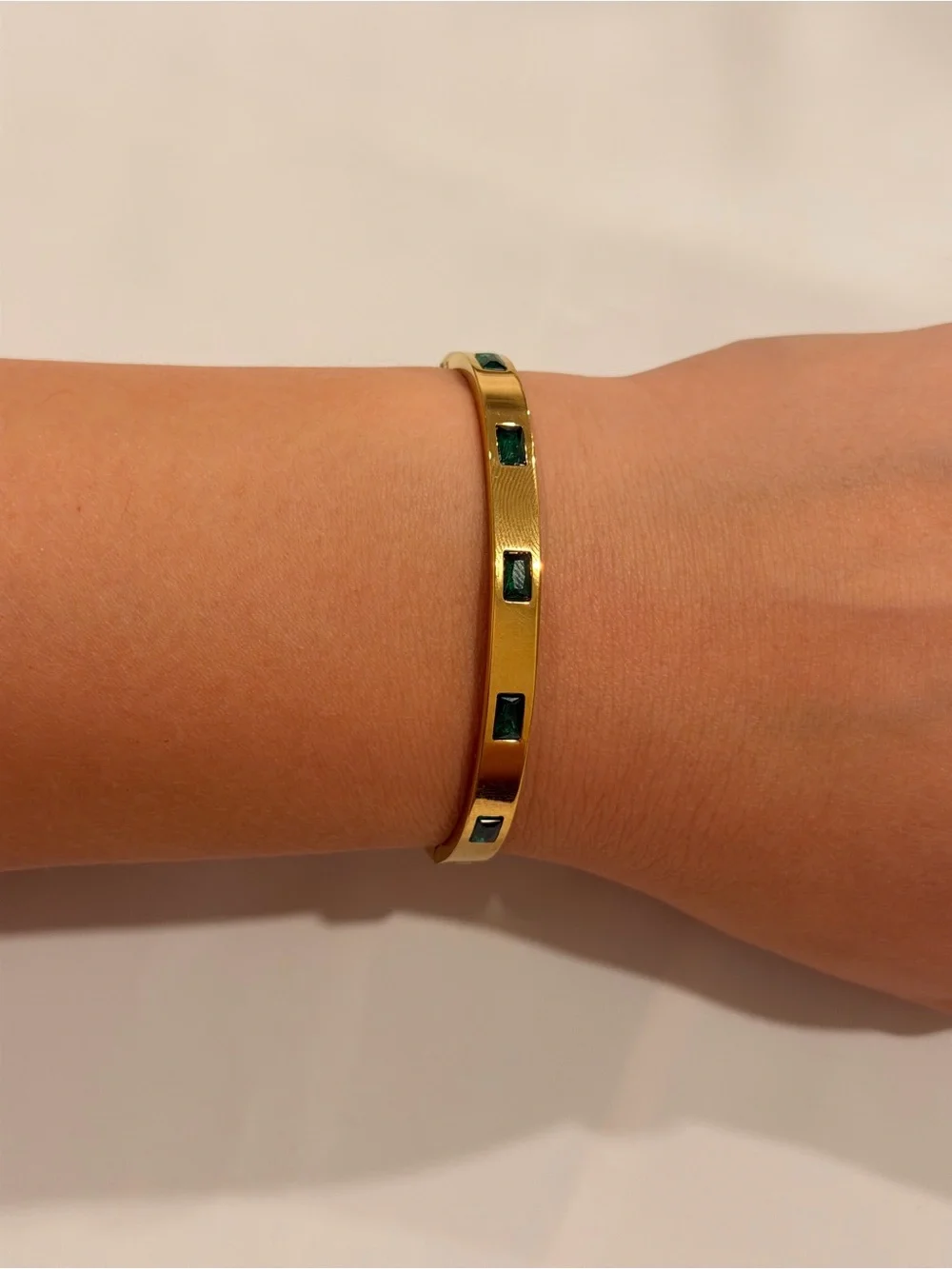 Gold Bangle with Emerald Green Accents